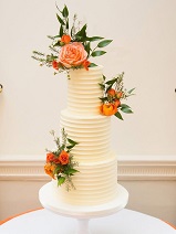 3 tier buttercream wedding cake orange